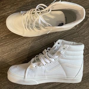 Women’s Size 9 all white high top Vans.